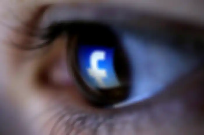 FILE PHOTO: A picture illustration shows a Facebook logo reflected in a person's eye, in Zenica, March 13, 2015. REUTERS/Dado Ruvic/Illustration/File Photo