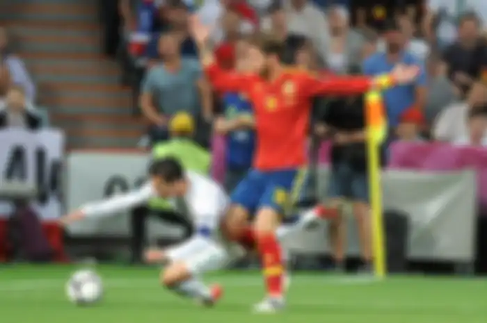Portugal's Cristiano Ronaldo (left) tumbles to the ground in the penalty area as he battles for the 