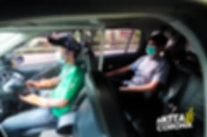 Armada khusus GrabCar yang dibuatkan pembatas antara pengemudi dengan penumpang.