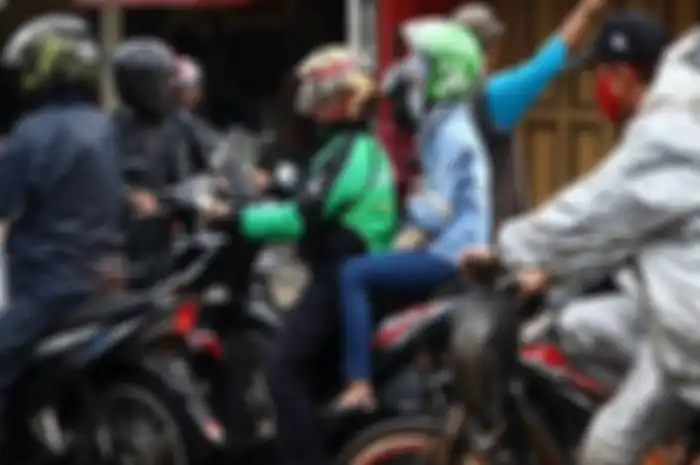 Ilustrasi driver ojol membawa penumpang.