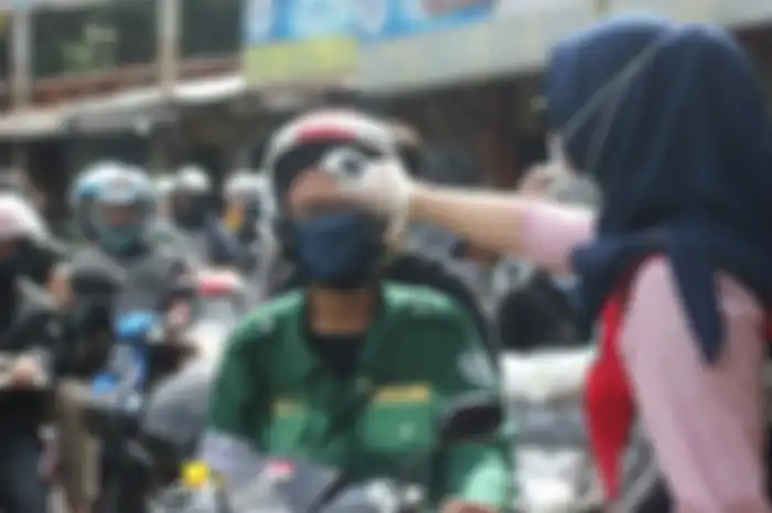 Ilustrasi naik motor. Ada aturan khusus berkendara untuk motor jelang new normal, begini penjelasan Pemprov DKI Jakarta.
