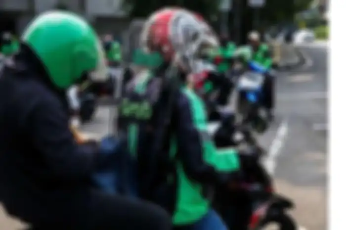 Ilustrasi driver ojol, Polisi bebaskan driver ojol tanpa STRP lewat titik penyekatan PPKM Darurat