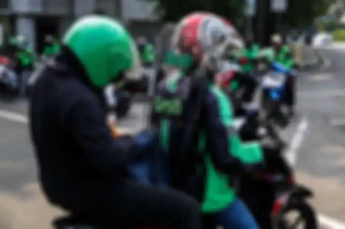 Ilustrasi driver ojek online. Simak protokol kesehatan buat penumpang dan driver ojol.