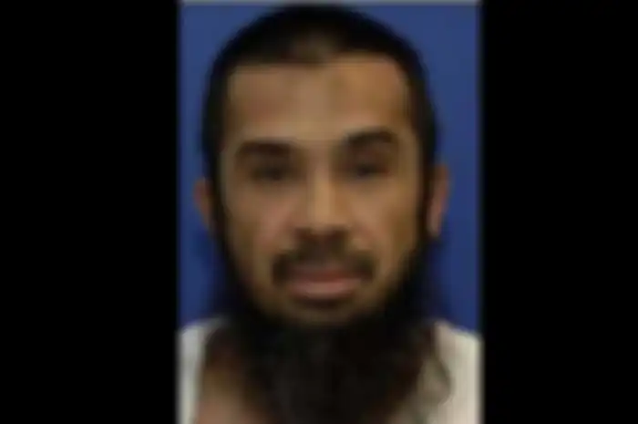 Riduan Isamuddin, lebih dikenal dengan nama Hambali, pemimpin kelompok Jemaah Islamiyah dan diyakini sebagai perwakilan tertinggi Al-Qaeda di Indonesia.