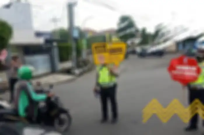 Ilustrasi polisi di kota Medan menghimbau bahaya virus Corona
