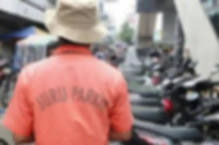 Foto ilustrasi. Tukang parkir yang nolak bayaran pakai uang parkir dikenai denda sampai segini.