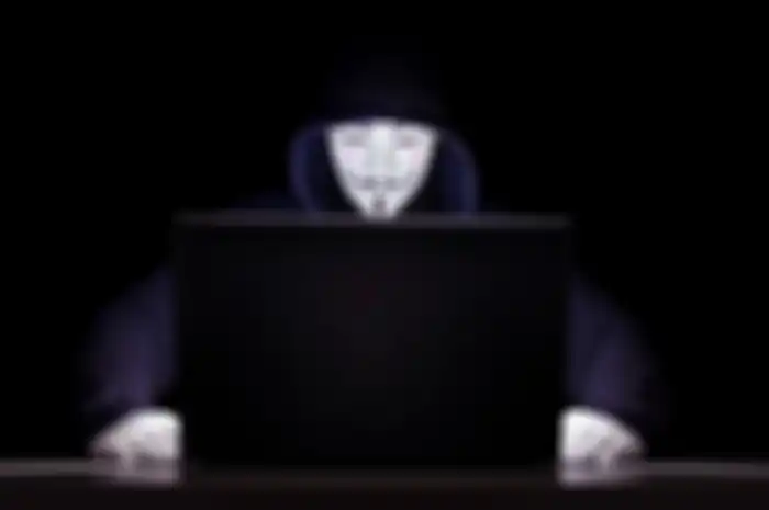 Ilustrasi sosok hacker Anonymous