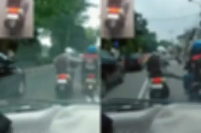 Tangkapa layar video viral pemotor Yamaha NMAX tendang motor pengawal ambulans.