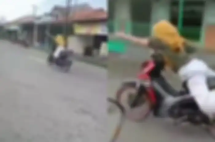 Atraksi emak-emak naik motor Honda Revo bergaya Superman enggak pakai helm.