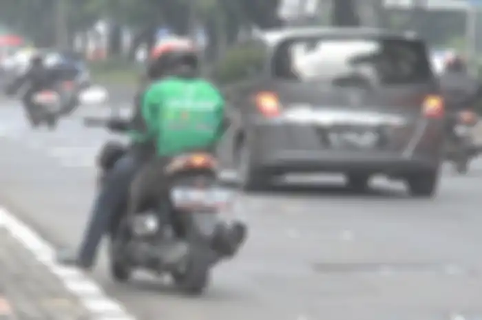 Ilustrasi driver ojol. Meski sudah demo, motor driver ojol tetap kena ERP.