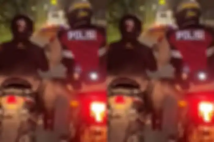 Supardi, pemudik motor yang dibantu seorang anggota polisi.
