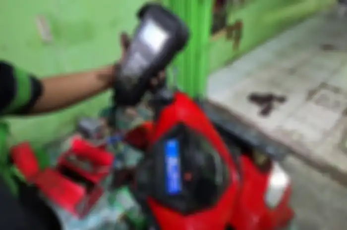 Ilustrasi servis motor matic. Ada promo servis motor murah di Rafi Matic cuma Rp 30 ribu.