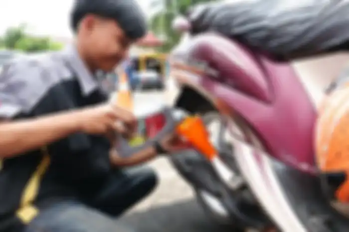 Foto ilustrasi proses ganti oli gratis dari Pertamina Lubricants.