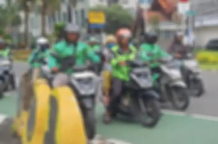 Ilustrasi, muncul wacana para driver ojol diangkat jadi karyawan tetap agar sejahtera, begini pandangan para pakar ekonomi.