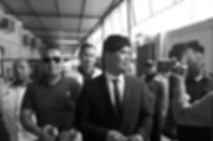 Musisi Ahmad Dhani saat menjalani sidang dalam kasus ujaran kebencian yang menjeratnya tahun 2018.