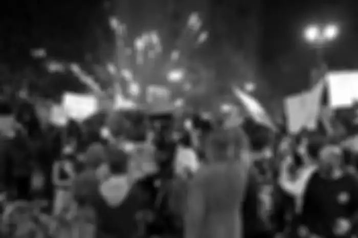 OAKLAND, CA - MAY 29: Fireworks explode during a demonstration in support of George Floyd at Broadway and 7th Street as protesters face off against a police line in Oakland, Calif., on Friday, May 30, 2020. (Anda Chu/Bay Area News Group)