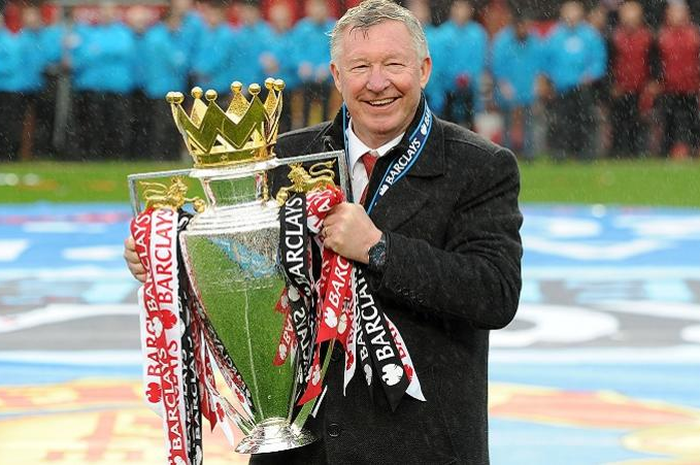 Manchester United manager Sir Alex Ferguson celebrates with the Barclays Premier League trophy, after the game
