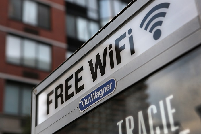 NEW YORK, NY - JULY 11:  A free Wi-Fi hotspot beams broadband internet from atop a public phone booth on July 11, 2012 in Manhattan, New York City. New York City launched a pilot program Wednesday to provide free public Wi-Fi at public phone booths around the five boroughs. The first ten booths were lit up with Wi-Fi routers attached to the top of existing phone booths, with six booths in Manhattan, two in Brooklyn, and one in Queens. Additional locations, including ones in the Bronx and Staten Island, are to be added soon.  (Photo by John Moore/Getty Images)