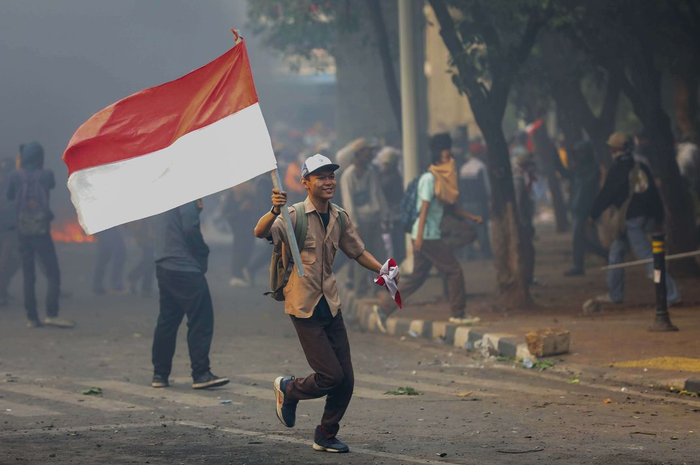 Pelajar melakukan Aksi Tolak RUKHP di Belakang Gedung DPR/MPR, Palmerah, Jakarta Barat, Rabu (25/9/2019).  