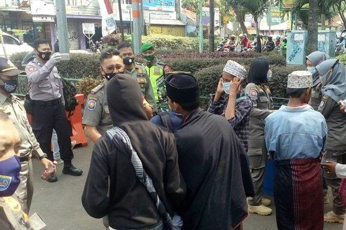 Ilustrasi razia masker.  Di Jalan Siliwangi, Pancoran Mas, Kota Depok, Senin (24/8/2020) lalu 
