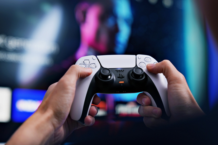 Ilustrasi bermain game PS5