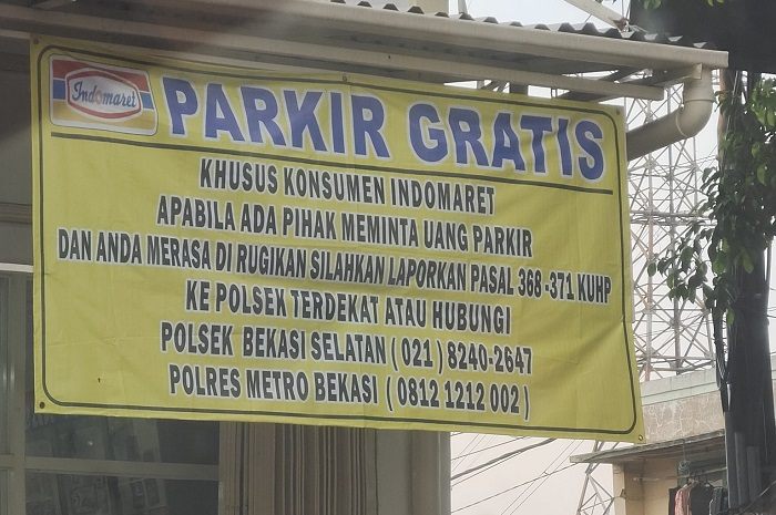 Viral tukang parkir bisa dilaporin ke polisi hingga masuk kurungan penjara, begini penjelasan Indomaret.