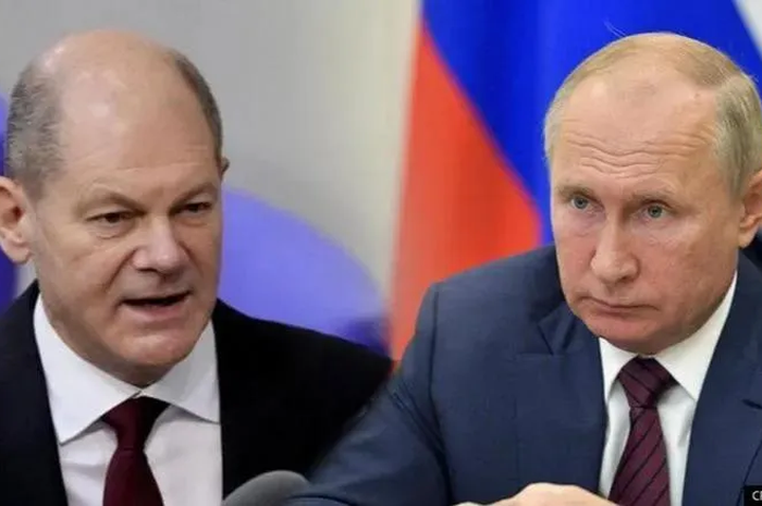 Ilustrasi konselor Jerman Olaf Scholz dan Vladimir Putin membahas perang Rusia