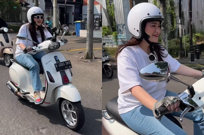 Nathalie Holscher riding naik Vespa Sprint putih kena modifikasi.