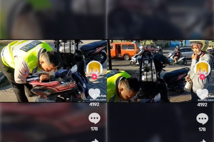 Aksi polisi tersebut viral di TikTok lantaran nekat menyedot bensin dari tangki motornya.