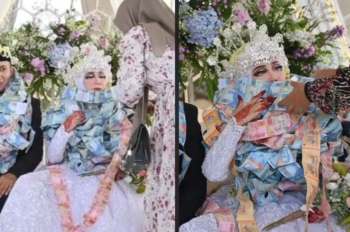 Pengantin wanita diberi banyak kalung uang oleh tamu undangan