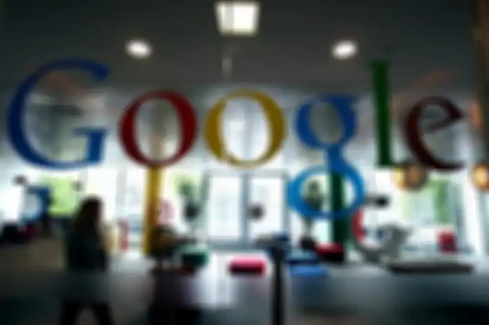 A Google Inc member of staff walks through the company headquarters in London, U.K., on Wednesday, Aug. 18, 2010. The German government will create a legal framework for consumer data protection in the Internet this year, reacting to a debate about the introduction of Google Inc.'s Street View service. Photographer: Simon Dawson/Bloomberg via Getty Images