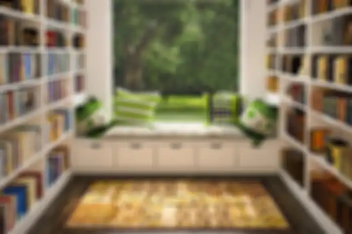 Desain perpustakaan sederhana yang menempati runag khusus di rumah.