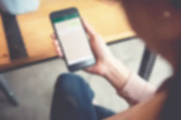 Social network, Chating and messaging concept, Closeup woman hand holding smart phone, Mock up to screen chat box.