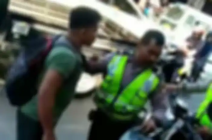 Pria berbadan kekar yang sempat viral karena mendorong dan memukul anggota polantas