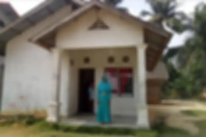 Ibunda Asraf di kediamannya di Desa Bina Baru, Kecamatan Kampar Kiri Tengah. Kabupaten Kampar, Riau, Rabu (14/8/2019).