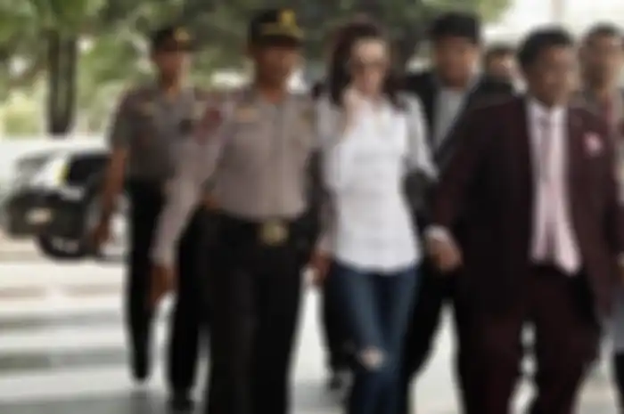 Jennifer Dunn didampingi pengacara Hotman Paris Hutapea, Jumat (14/2/2014).