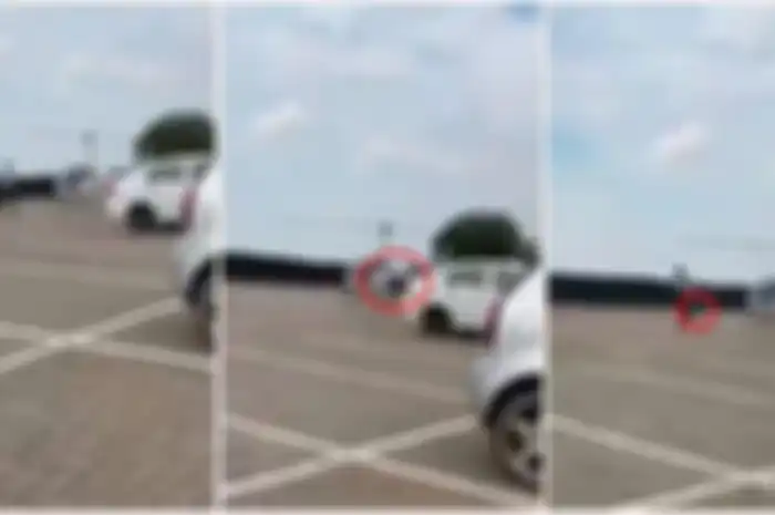Video pria dengan santainya berjalan ke helikopter yang berhenti di tempat parkir.