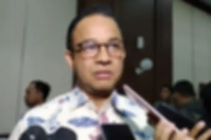 Anies Baswedan, usai mengikuti rapat soal persiapan pemindahan ibu kota baru di Kantor Bappenas, Jumat (15/11/2019). 
