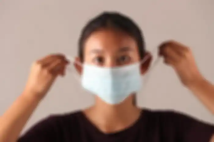 Ilustrasi penggunaan masker untuk mencegah virus corona