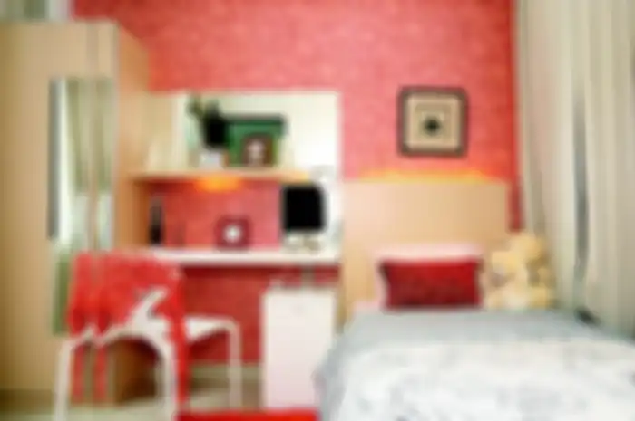 Warna jingga di kamar remaja putri penambah semangat dan pemicu kreativitas.