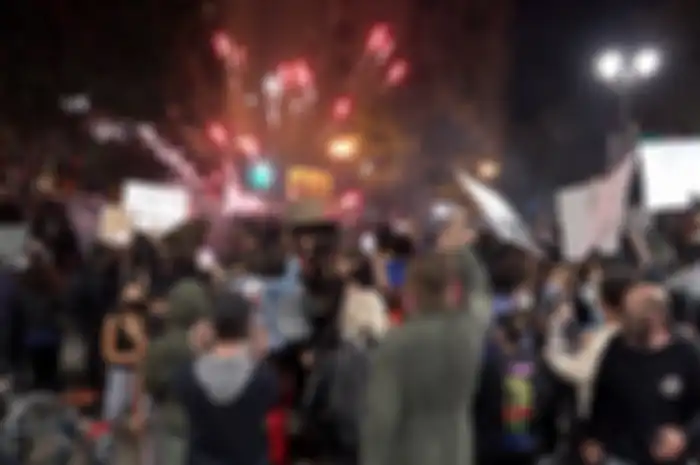 OAKLAND, CA - MAY 29: Fireworks explode during a demonstration in support of George Floyd at Broadway and 7th Street as protesters face off against a police line in Oakland, Calif., on Friday, May 30, 2020. (Anda Chu/Bay Area News Group)