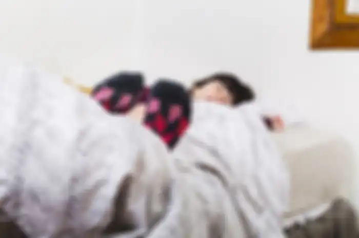 Manfaat memakai kaus kaki saat tidur