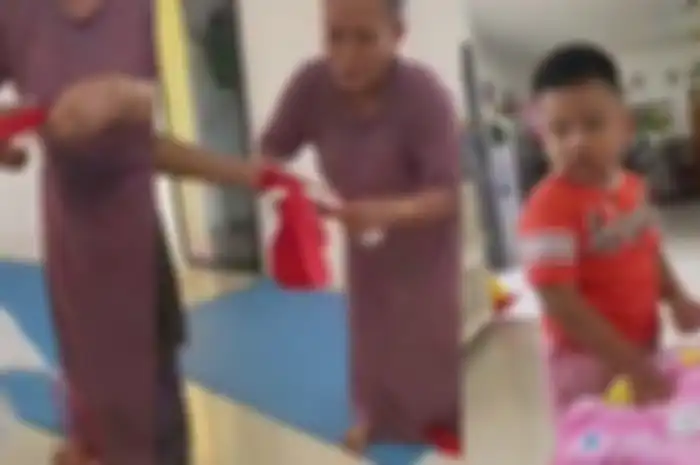 Aksi seorang emak-emak gunting bendera merah putih, viral di media sosial.