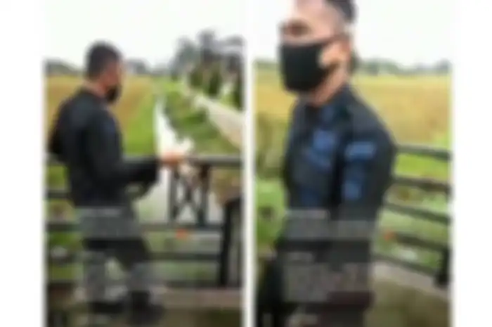 Tangkapan layar video diduga oknum anggota Polri membanting anak kucing ke parit.