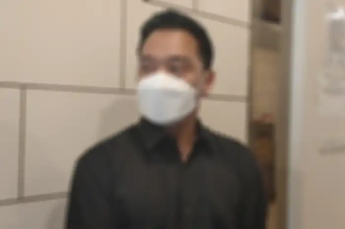 Michael Yukinobu de Fretes saat ditemui seusai wajib lapor kasusnya di Subdit Cyber Crime, Polda Metro Jaya, Kamis (14/1/2021).