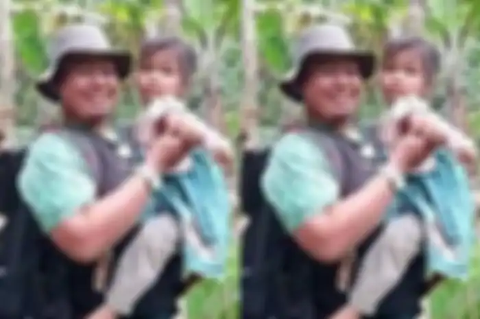 Lia (6) digendong salah satu relawan di tempat tinggal sementara.
