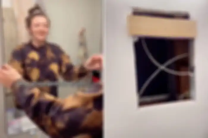 TikToker Samantha Hartsoe menemukan ruang rahasia yang tersembunyi di balik cermin kamar mandi apartemennya. [@samanthartsoe/TikTok Via New York Post] 