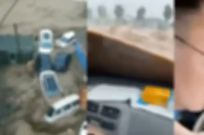 Pria terjebak terjebak di dalam mobil saat gelombang banjir lumpur mulai menenggelamkan jalanan provinsi Henan.