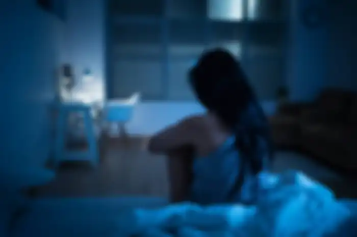 Asian woman with depression She is stressed She couldn't sleep and was in bed.
