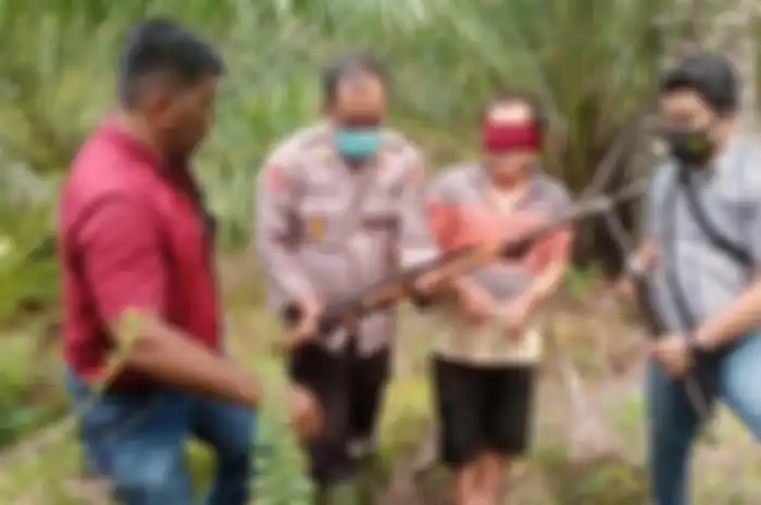 Pelaku penembak RM di Aek kuasa, Kabupaten Asahan diamankan oleh tim Unit Reserse Kriminal Polsek Pulau Raja, Jumat(24/9/2021). 